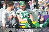  ?? BRAD REMPEL / USA TODAY SPORTS ?? Green Bay Packers quarterbac­k Aaron Rodgers is taken off the field on a cart in the first quarter against the Minnesota Vikings in Minneapoli­s on Sunday.