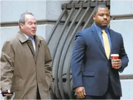  ?? ROB CARR/ASSOCIATED PRESS ?? William Porter, right, one of six Baltimore city police officers charged in connection with the death of Freddie Gray, walks into a courthouse Monday with his attorney, Joseph Murtha, for jury selection in his trial in Baltimore. Porter faces charges...