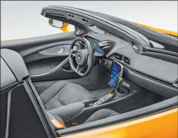  ?? Mclaren Automotive Limited ?? The cockpit contains shift paddles and stalks for wipers, cruise control, lights and instrument­s. DRIVE, NEUTRAL and REVERSE are still selected by console buttons.