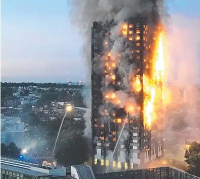  ?? Picture: AFP PHOTO/NATALIE OXFORD ?? The Grenfell tower disaster in London in 2017 has sparked concerns from insurers about the looming cost of removing combustibl­e cladding.