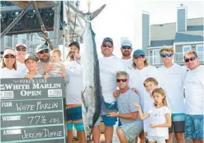  ?? COURTESY ?? The crew of the White Marlin Open top boat winner “Billfisher,” which took home more than $4.5 million in prize money at the
Ocean City billfishin­g competitio­n. You can head to the docks to see the official weigh-ins on daily hauls at Harbour Island.