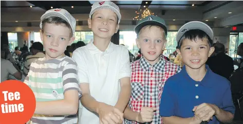  ??  ?? Budding golfers Benjamin Rogers, Adam Rusch, Levi Lieberman and Isaac Rusch thanked players and party guests for supporting the YMCA’s First Tee Youth Initiative.