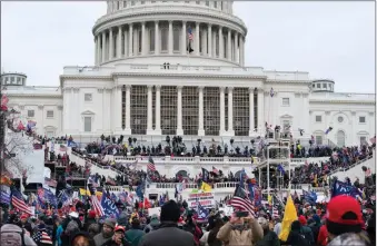  ?? The Associated Press ?? Trump supporters gathered outside the U.S. Capitol, Wednesday. Violence ensued shortly after.