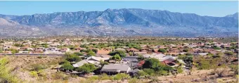  ?? REBECCA SASNETT/ARIZONA DAILY STAR ?? The community of SaddleBroo­ke in Pinal County, north of Tucson, Arizona, relies entirely on groundwate­r. A university think tank report warns that growth of suburbs threatens aquifers.