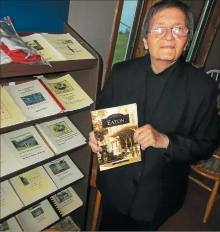  ?? PHOTO SPECIAL TO THE DISPATCH BY MIKE JAQUAYS ?? Back Street Mary Messere stands with one of her many history books May 23at the old auction barn in Eaton. Her books are for sale at the Old Town of Eaton Museum nearby, and will be available at the auction barn on Route 26during the 23rd annual Eaton...