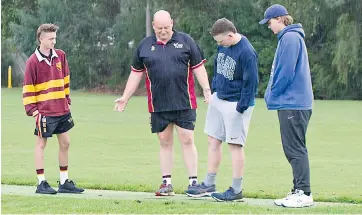  ??  ?? The under 16 clash between Drouin and Ellinbank was called off after an inspection by (from left) Cameron Caddy, Michael Caddy, Sam Pratt and Adam Campbell on Saturday morning.
