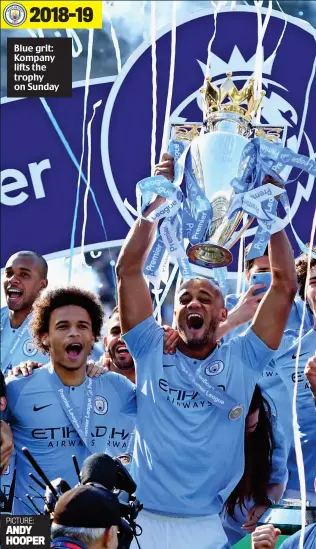  ??  ?? Blue grit: Kompany lifts the trophy on Sunday