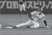  ?? Eugene Hoshiko Associated Press ?? SHOHEI OHTANI slides into second in Japan’s 10-2 win over the Czech Republic at the WBC in Tokyo.