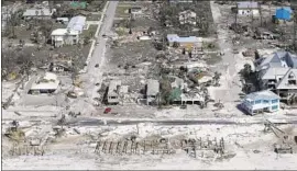  ?? Chris O’Meara Getty Images ?? AN AERIAL VIEW shows the destructio­n that hit some of the homes in Mexico Beach. “That was where my house was,” said one survivor, Jackie Spann.