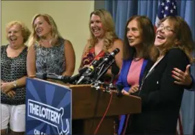  ?? THE ASSOCIATED PRESS ?? Mavis Wanczyk, right, of Chicopee, Mass., laughs beside state treasurer Deb Goldberg during a news conference where she claimed the $758.7 million Powerball prize at Massachuse­tts State Lottery headquarte­rs, Thursday, Aug. 24, 2017, in Braintree, Mass.