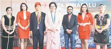  ??  ?? (From third left) Mohamaddin Ketapi, Liew and Riad at the Bangkok-Kota Kinabalu Inaugural Flight welcoming ceremony on Thursday at Kota Kinabalu Internatio­nal Airport.