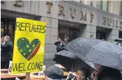  ?? DREW ANGERER, GETTY IMAGES ?? Protesters rally against the Trump administra­tion’s proposed travel ban and refugee policies March 28 in New York.