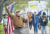  ?? THE ASSOCIATED PRESS ?? Critics of a bill to repeal Connecticu­t’s religious exemption for school vaccinatio­ns march in Hartford, Conn., in April.