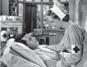 ?? Warner Bros. ?? Cary Grant stars as a songwriter who courts a young nurse (Alexis Smith) after suffering injuries while serving during World War I in “Night and Day.”