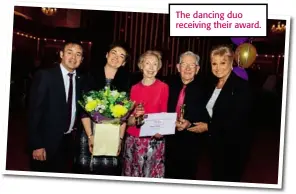  ??  ?? The dancing duo receiving their award.