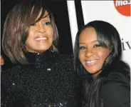  ?? Dan Steinberg / Associated Press 2011 ?? Bobbi Kristina Brown (right, with mother Whitney Houston) was found unresponsi­ve in a bathtub.