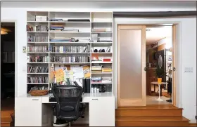  ?? Washington Post/KATHERINE FREY ?? Frosted pocket doors can close off the home office from the rest of the house.