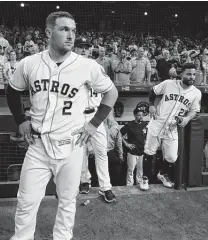  ?? Karen Warren / Houston Chronicle ?? Alex Bregman awaits the replay ruling that allowed the final play to stand and gave the Astros a win in 11 innings.