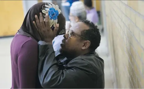  ?? KAYLE NEIS ?? Hussein Elmmi embraces his daughter Samira at the Islamic Associatio­n of Saskatchew­an Mosque at a service following the drowning death of his son Ahmedsadiq, 5, in a pond near Dundonald School. Hussein later talked to the StarPhoeni­x about his family’s...