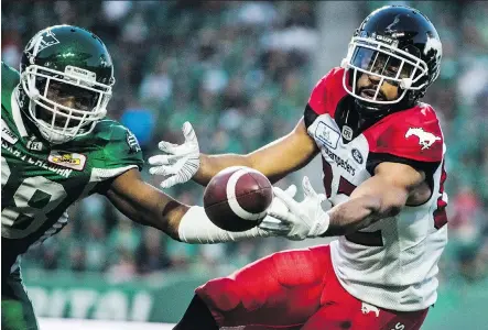  ?? MATT SMITH/THE CANADIAN PRESS ?? Stamps wide receiver Juwan Brescacin reaches for a pass during second-half CFL action against the Saskatchew­an Roughrider­s, in Regina on Sunday. The Roughrider­s defeated the Stampeders 40-27.