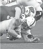  ?? FOND DU LAC REPORTER ?? Wisconsin linebacker Jack Sanborn sacks Penn State quarterbac­k Sean Clifford on Sept. 4 in Madison, Wis. The Badgers rank second in the nation in total defense.