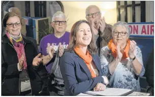  ?? MITCH MACDONALD/THE GUARDIAN ?? Susan MacVittie announces her bid for the NDP P.E.I. leadership while surrounded by party members at Timothy’s World Coffee on Tuesday.