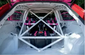  ??  ?? ABOVE: Stripped and caged interior is home to custom fuel cell