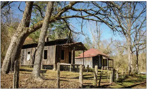  ??  ?? The Washhouse with the gabled roof (left) and the Bundy House with the hip roof were built about 1899 and have board and batten siding. According to the National Register of Historic Places Nomination form, the Washhouse was built in a rougher style while the Bundy house would have been “a fine dwelling in its day.”