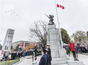  ??  ?? Last year’s Remembranc­e Day service at the Victoria cenotaph. A letter-writer urges individual­s and businesses to put off Christmas decoration­s until after Nov. 11.