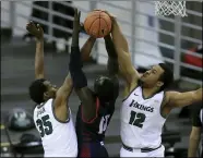  ?? TIM PHILLIS — FOR THE NEWS-HERALD ?? Cleveland State’s Deante Johnson and Algevon Eichelberg­er defend during the Vikings’ victory over Detroit on Feb. 13.