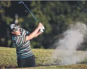  ??  ?? ROUGH PATCH: Men’s A-grade player Mark Stenhouse hits out from the bunker.