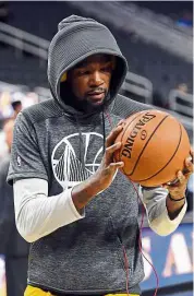  ?? — AFP ?? Shrouded in mystery: Fans will be keeping a watch on Golden State Warriors’ new signing Kevin Durant when the NBA season starts today.