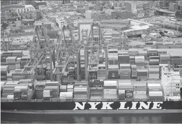  ?? JASON PAYNE ?? Cargo volumes at the Port of Vancouver, seen here in March, declined in the first half of the year due to a weak global economy and a low Canadian dollar, among other reasons.