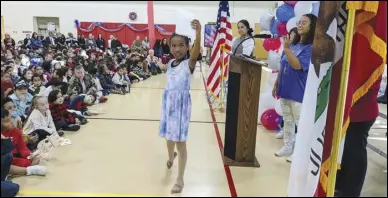  ?? JULIE DRAKE/ VALLEY PRES ?? Palmdale Learning Plaza fourth-grader Jewel Daniels performed a dance — “A Letter From Home” — Thursday morning, during a studentled Veterans Day program organized by the school’s new S2S Club, or Student 2 Student and new Builders Club.