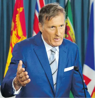  ?? ADRIAN WYLD / THE CANADIAN PRESS ?? Maxime Bernier announces he is leaving the Tory party in Ottawa on Thursday, on the eve of the party convention.