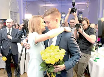  ??  ?? Kallas celebrates with party members after winning Estonia’s general election in Tallin. — AFP photo
