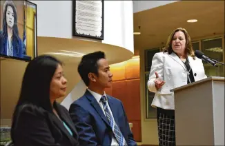  ?? HYOSUB SHIN / HSHIN@AJC.COM ?? Gwinnett County Solicitor Rosanna Szabo (right) speaks as State Rep. Brenda Lopez (left), herself an attorney, and attorney Ethan Pham listen during a press conference Thursday to educate the public — especially foreign-born residents — about fake...