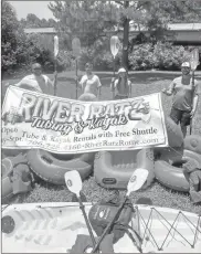  ?? Contribute­d ?? River Ratz’s new management holds their sign as they prepare to reopen the shop this weekend.