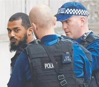  ?? Picture: AFP ?? British police detain the terror suspect near Westminste­r.