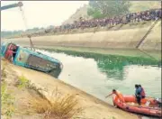  ?? PTI ?? An NDRF team carries out rescue operations after a bus plunged into a canal in Madhya Pradesh’s Sidhi district on Tuesday