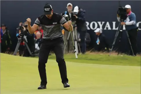  ?? BEN CURTIS, THE ASSOCIATED PRESS ?? Henrik Stenson of Sweden celebrates a birdie putt on the 18th green that gave him a three-stroke win Sunday in The Open Championsh­ip at Royal Troon Golf Club in Scotland.