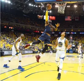  ??  ?? Cleveland Cavaliers’ LeBron James (23) shoots against Golden State Warriors guard Shaun Livingston (34) in Game 1 of the NBA Finals in California on Thursday.