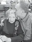  ??  ?? Owner George Mickelis kisses his mother, Pat, who is a daily presence in the dining room.