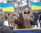  ?? EMILIO MORENATTI/AP ?? Nina Nikiforova cries at the funeral Saturday for her son Oleg Kunynets, a Ukrainian soldier.