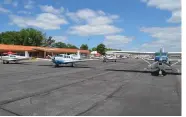  ?? (Special to The Commercial/Richard Ledbetter) ?? More than 35 small engine aircraft from all points of the compass crowded the tarmac outside Grider Field terminal for Operation Skyhook.