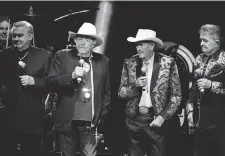  ?? TERRY WYATT/ GETTY IMAGES ?? Jimmy C. Newman, third from left, shown with Jim Ed Brown, Bobby Bare and Bill Anderson, perform in Nashville last November.