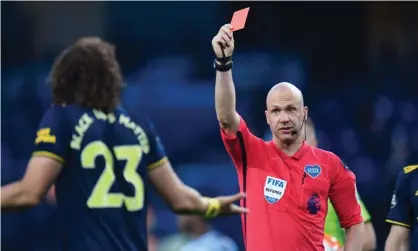  ?? Photograph: Peter Powell/Reuters ?? David Luiz is shown a red card by Anthony Taylor to cap a game to forget. He came on midway through the first half, was at fault for City’s first goal and conceded a penalty.