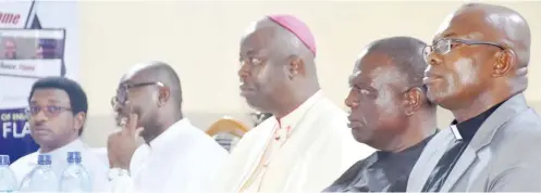  ?? Photo: NAN ?? „ From left: Former Director of Communicat­ions, Catholic Diocese of Enugu, Rev Fr. Benjamin Achi; Diocesan Chancellor; Very Rev. Fr. Wilfred Agubuchie; Catholic Bishop of Enugu, Most Rev Dr Callistus Onaga; representa­tive of the President Customary Court of Appeal, Justice Emmanuel Nnamani; and Guest Lecturer, Rev. Fr. Ebere Uwah, during 57th World Communicat­ions Day celebratio­ns by the Directorat­e of Social Communicat­ions, Catholic Diocese of Enugu at the Holy Ghost Cathedral in Enugu yesterday