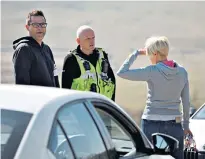  ??  ?? Police on horseback speak to motorists in Tynemouth, top. Above, moving people along on Brighton beach and questionin­g a visitor to Mam Tor in the Peak District