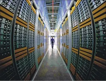  ?? Jonathan Nackstrand AFP/Getty Images ?? FACEBOOK says that since the company is the only entity gathering and monetizing personal data within its system, it does not engage in sales of user data to third parties. Above, a Facebook server room is seen in 2013.